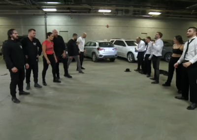 Eleven people meet in the parking lot of the arena to discuss their differences