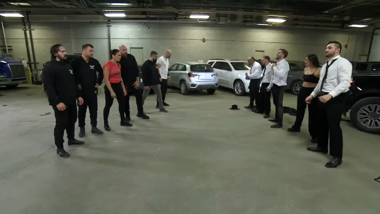 Eleven people meet in the parking lot of the arena to discuss their differences
